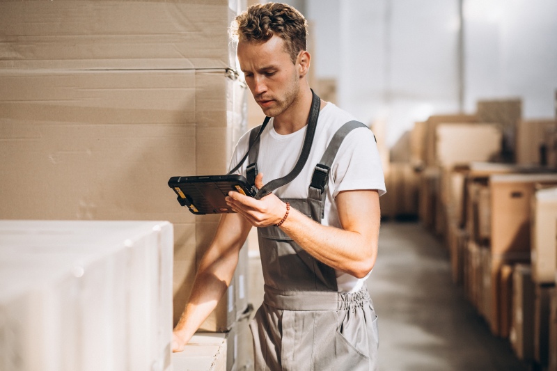 young man working warehouse with boxes800px07102025 2